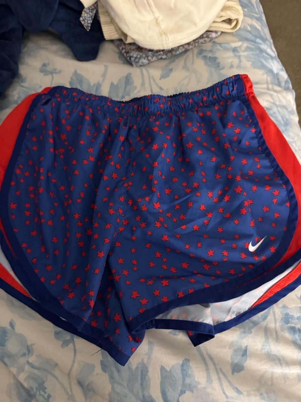 Nike Blue Shorts with Red Star Print and Red Side Panels